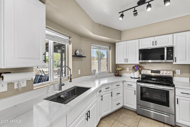 6605 W Altadena Ave, Glendale, AZ 85304 - kitchen featuring stainless steel appliances, white cabinets, light tile patterned flooring, and light stone countertops