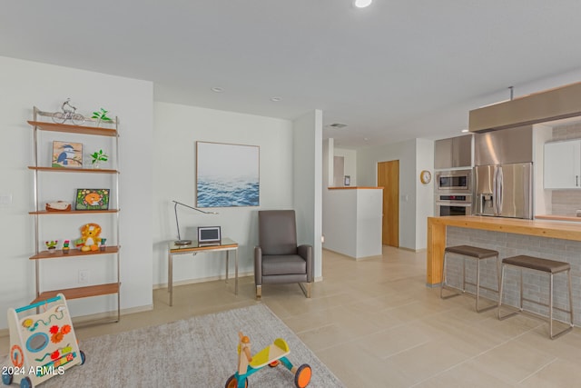 playroom with light tile patterned floors