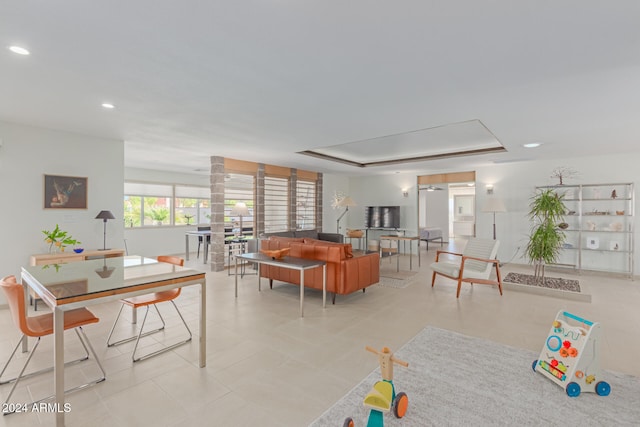 dining area with a tray ceiling