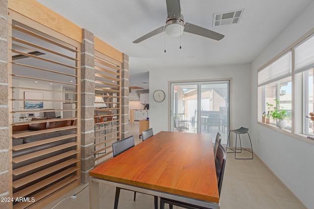 home office with a wealth of natural light and ceiling fan