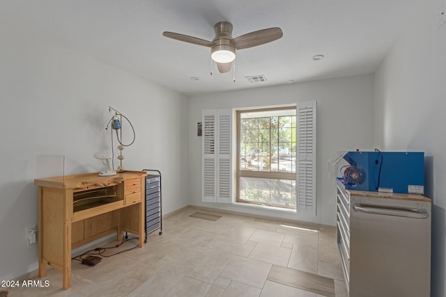 interior space featuring ceiling fan and light tile patterned floors