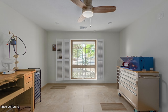 bedroom featuring light tile patterned floors and ceiling fan