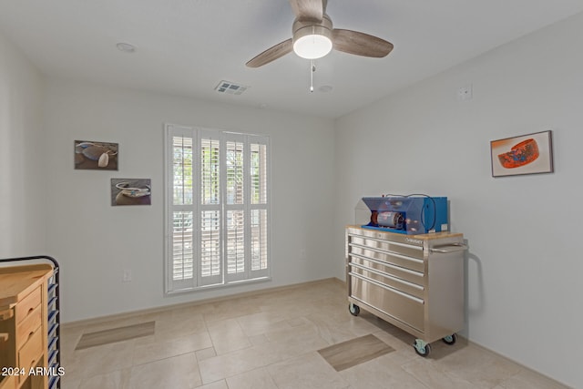 interior space featuring ceiling fan