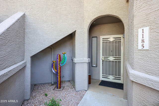 15225 N 100th St Unit 1185, Scottsdale, AZ 85260 - doorway to property with stucco siding