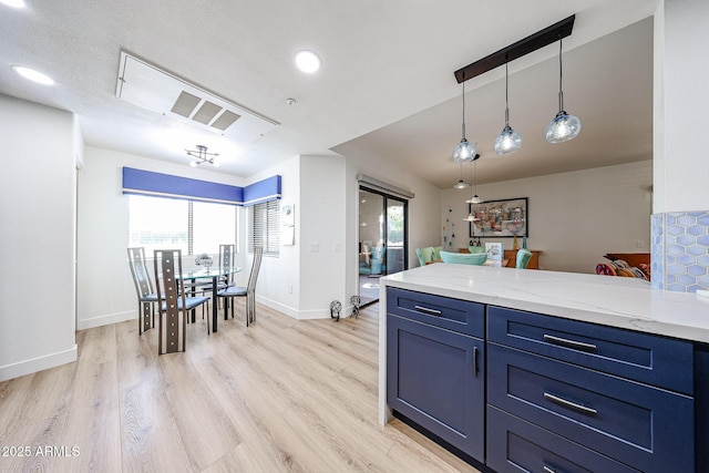 15225 N 100th St Unit 1185, Scottsdale, AZ 85260 - kitchen featuring healthy amount of natural light, a peninsula, blue cabinets, and recessed lighting