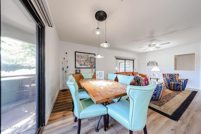 15225 N 100th St Unit 1185, Scottsdale, AZ 85260 - dining space featuring healthy amount of natural light, wood finished floors, and a ceiling fan