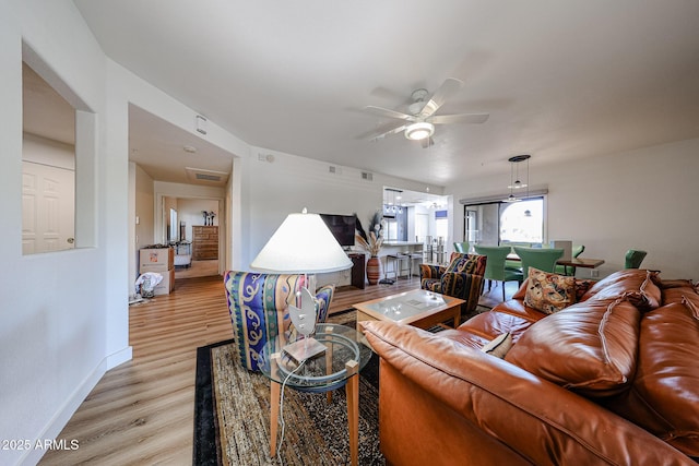 15225 N 100th St Unit 1185, Scottsdale, AZ 85260 - living room featuring a ceiling fan and light wood-type flooring