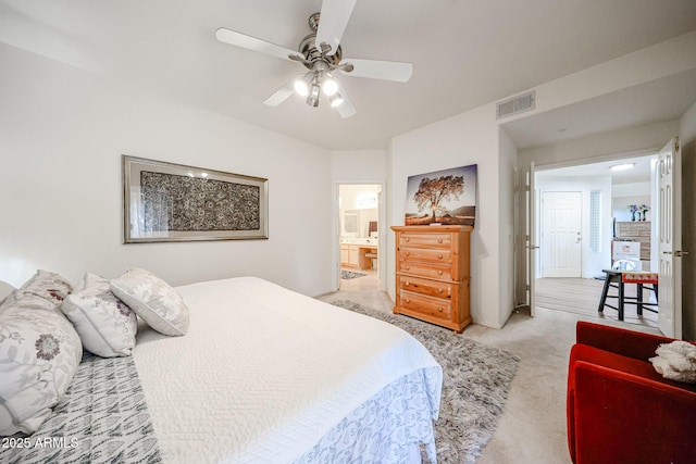 15225 N 100th St Unit 1185, Scottsdale, AZ 85260 - bedroom with light colored carpet, ensuite bathroom, and a ceiling fan