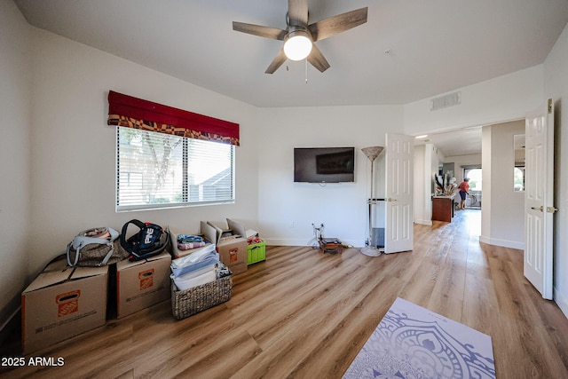 15225 N 100th St Unit 1185, Scottsdale, AZ 85260 - living room with light wood finished floors, healthy amount of natural light, and ceiling fan