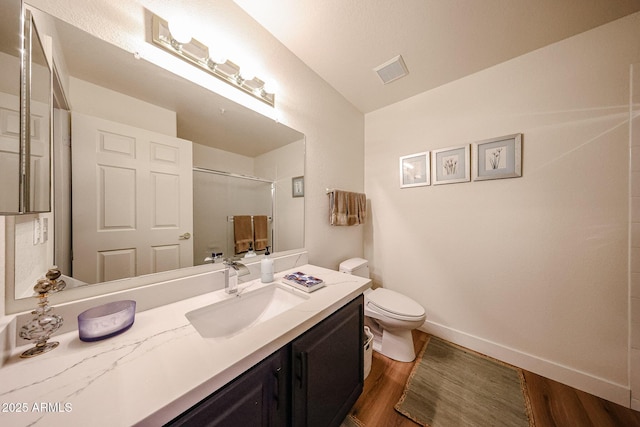 15225 N 100th St Unit 1185, Scottsdale, AZ 85260 - bathroom featuring wood finished floors, vanity, and a shower