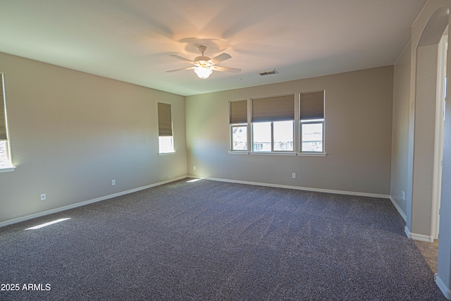 3796 E Rakestraw Ln, Gilbert, AZ 85298 - spare room featuring ceiling fan, dark carpet, and baseboards