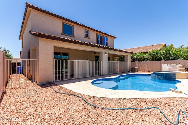 3796 E Rakestraw Ln, Gilbert, AZ 85298 - view of swimming pool with a fenced backyard, a patio, a pool with connected hot tub, and a ceiling fan