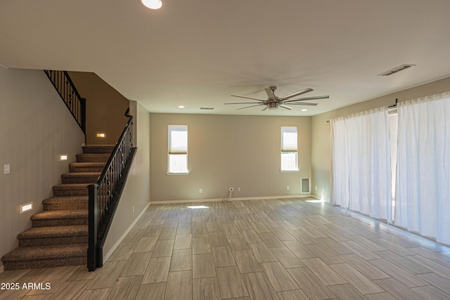 3796 E Rakestraw Ln, Gilbert, AZ 85298 - unfurnished living room with stairs, ceiling fan, plenty of natural light, and recessed lighting