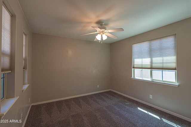 3796 E Rakestraw Ln, Gilbert, AZ 85298 - spare room with a ceiling fan, dark carpet, and baseboards