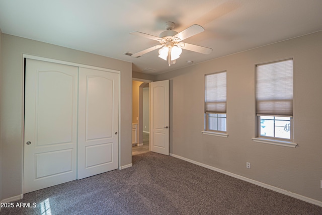 3796 E Rakestraw Ln, Gilbert, AZ 85298 - unfurnished bedroom featuring baseboards, a closet, dark colored carpet, and ceiling fan