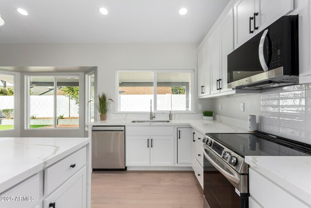 kitchen featuring recessed lighting, appliances with stainless steel finishes, and a sink