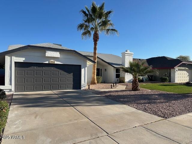 view of front of home with an attached garage and driveway
