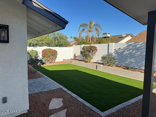 view of yard featuring a fenced backyard