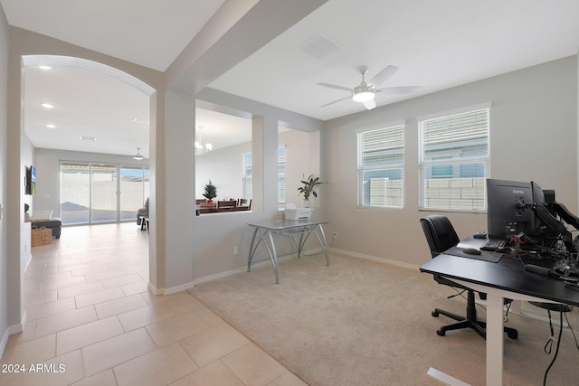 15072 W Mckinley St, Goodyear, AZ 85338 - home office with visible vents, baseboards, ceiling fan, light tile patterned floors, and light colored carpet