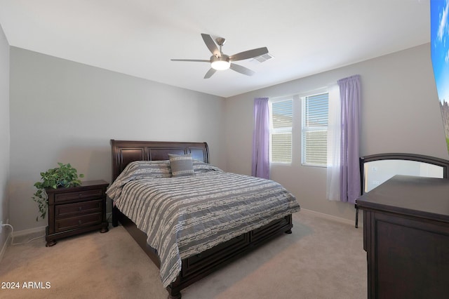 15072 W Mckinley St, Goodyear, AZ 85338 - bedroom with light colored carpet, visible vents, baseboards, and a ceiling fan