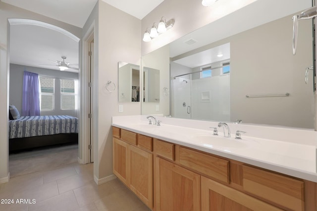 15072 W Mckinley St, Goodyear, AZ 85338 - ensuite bathroom with tile patterned floors, a sink, connected bathroom, a stall shower, and ceiling fan
