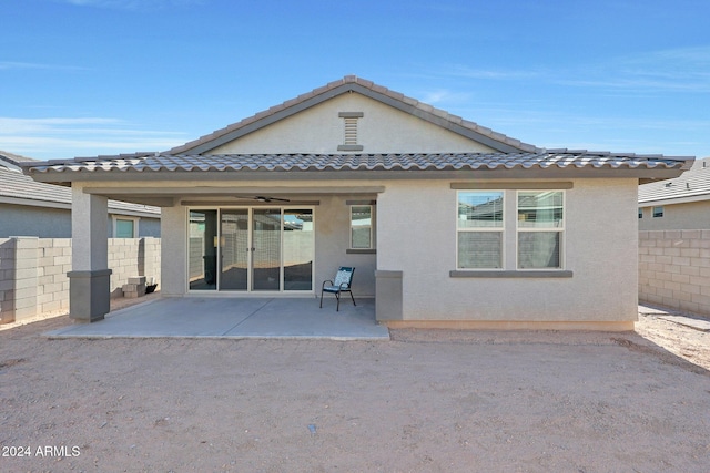 15072 W Mckinley St, Goodyear, AZ 85338 - rear view of property featuring fence, stucco siding, and a patio