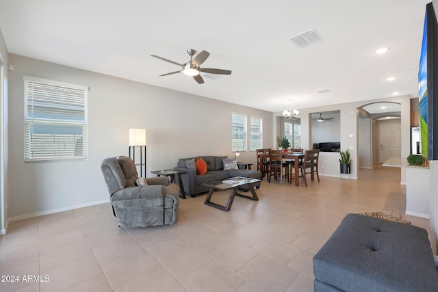 15072 W Mckinley St, Goodyear, AZ 85338 - living area featuring baseboards, ceiling fan with notable chandelier, visible vents, arched walkways, and recessed lighting