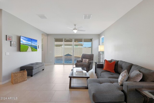 15072 W Mckinley St, Goodyear, AZ 85338 - living room featuring a ceiling fan, baseboards, and visible vents
