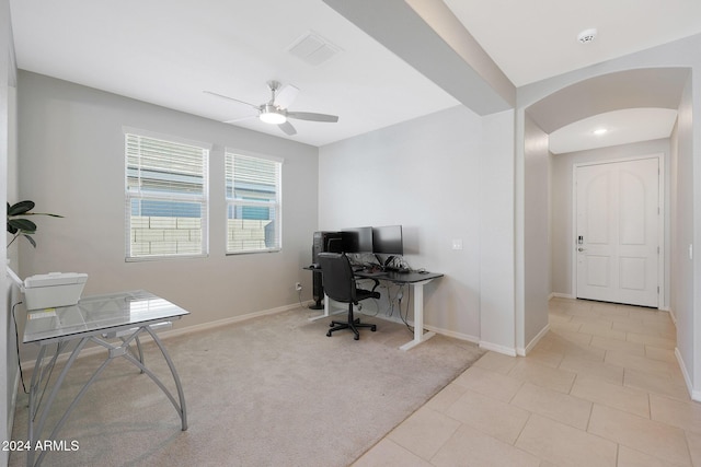15072 W Mckinley St, Goodyear, AZ 85338 - office with visible vents, baseboards, a ceiling fan, arched walkways, and light colored carpet