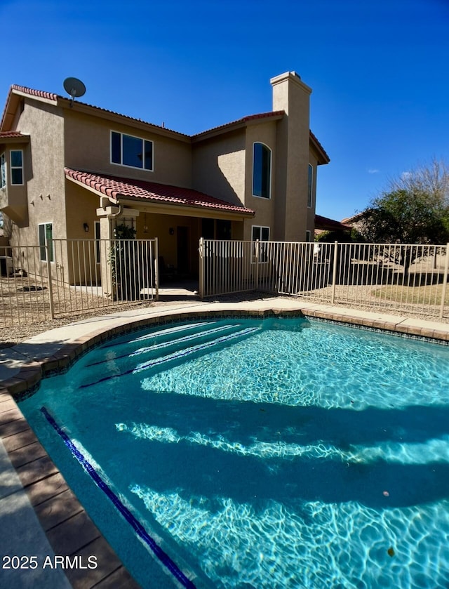 view of pool featuring a fenced in pool, a patio, and fence