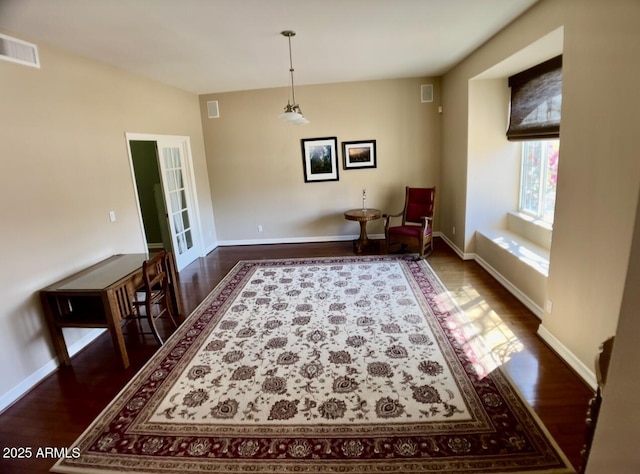 sitting room featuring visible vents, baseboards, and dark wood-style floors