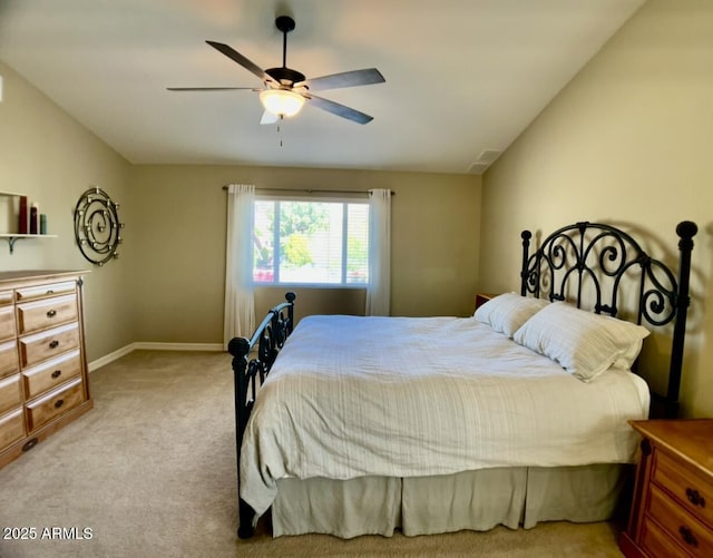 carpeted bedroom featuring baseboards, ceiling fan, and vaulted ceiling