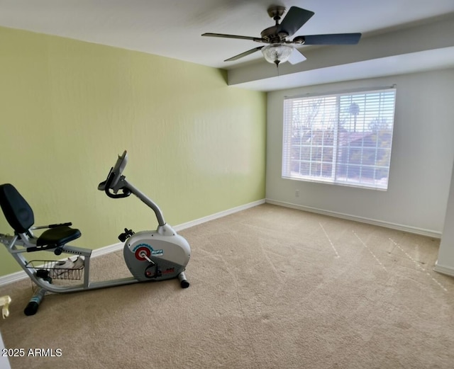 exercise room with ceiling fan, baseboards, and carpet