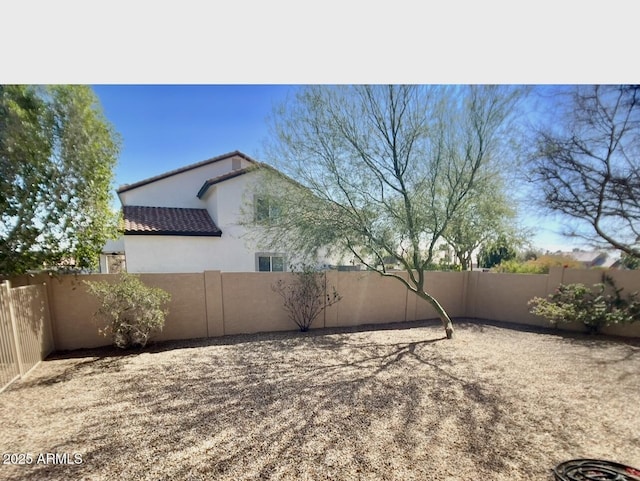 view of yard with a fenced backyard