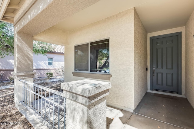 doorway to property with stucco siding