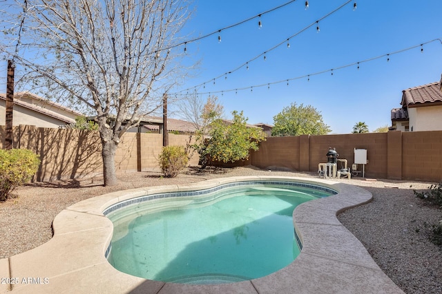 view of swimming pool featuring a fenced in pool and a fenced backyard