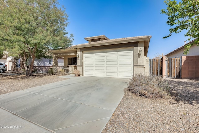 ranch-style house featuring driveway, an attached garage, fence, and stucco siding