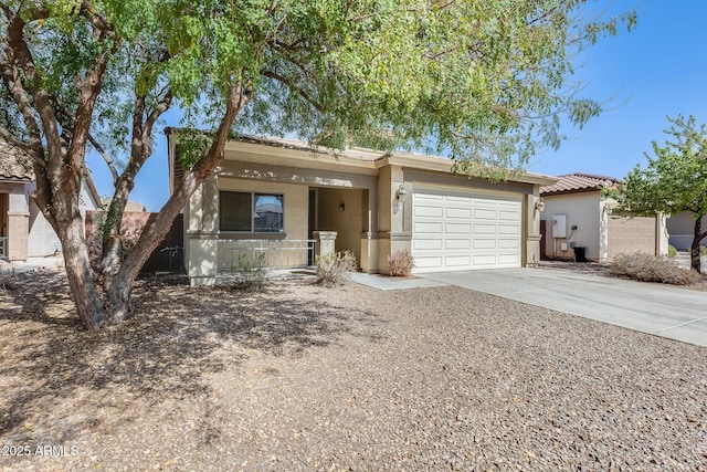 view of front of house featuring driveway, an attached garage, a tile roof, and stucco siding