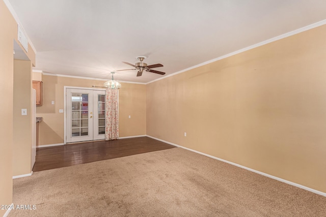 empty room with french doors, ceiling fan, crown molding, and wood-type flooring