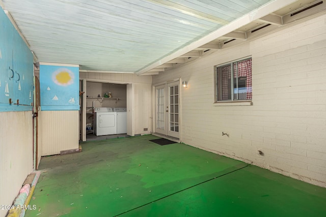 view of patio with washing machine and clothes dryer and french doors