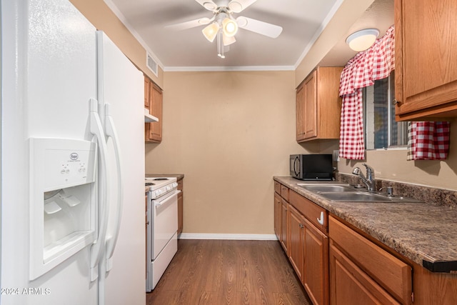 kitchen featuring ceiling fan, sink, dark hardwood / wood-style flooring, crown molding, and white appliances