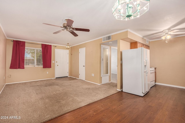 unfurnished living room with crown molding, ceiling fan, and hardwood / wood-style flooring