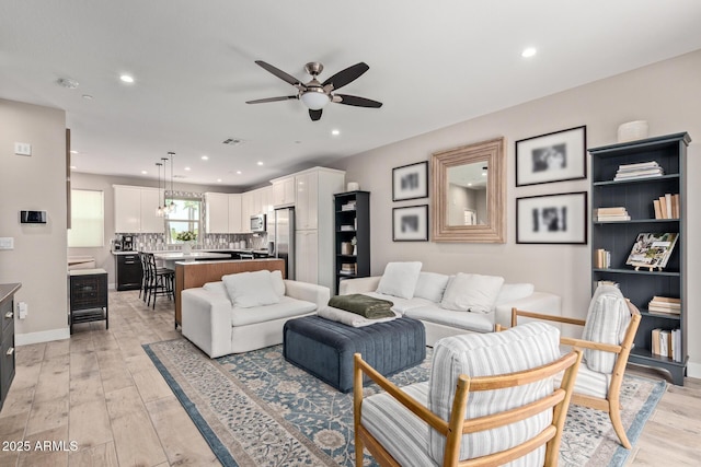 820 N 8th Ave Unit 14, Phoenix, AZ 85007 - living room with a ceiling fan, light wood-style flooring, and recessed lighting