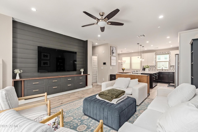 820 N 8th Ave Unit 14, Phoenix, AZ 85007 - living area with ceiling fan, recessed lighting, wooden walls, an accent wall, and light wood finished floors