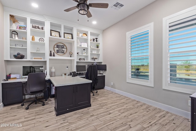 office area with light wood-type flooring and ceiling fan