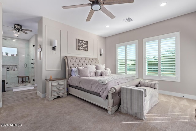 bedroom featuring ceiling fan and light carpet