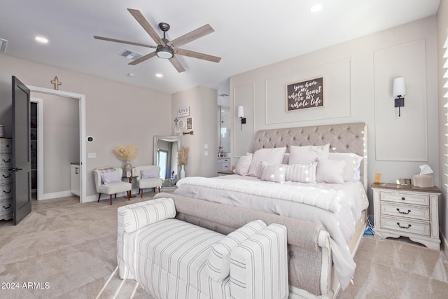 bedroom with ceiling fan and light colored carpet