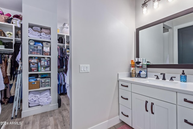 bathroom featuring vanity and hardwood / wood-style flooring