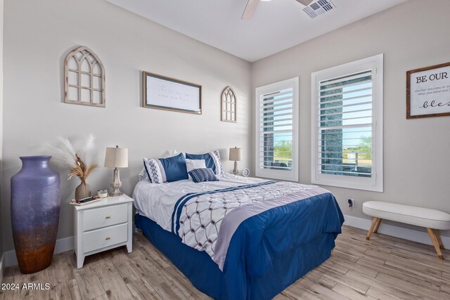 bedroom featuring ceiling fan and light hardwood / wood-style floors