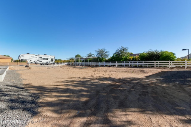 view of yard with a rural view